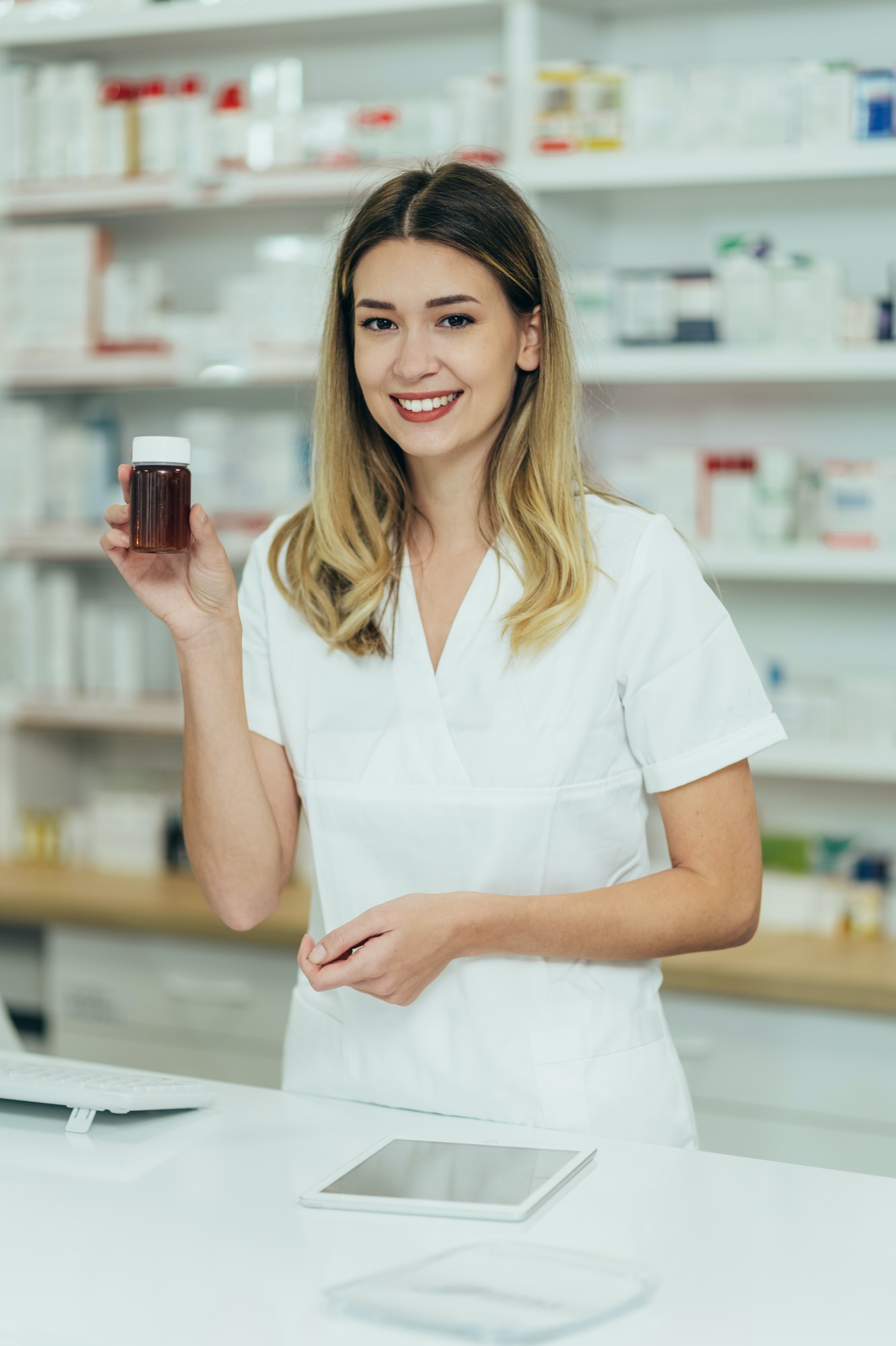 portrait of a beautiful female pharmacist working in a pharmacy 1